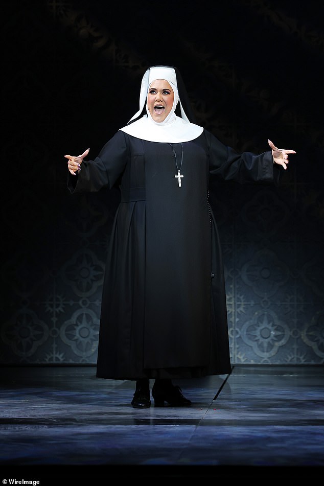 1723215796 839 Casey Donovan thrills audiences in a daring latex nuns habit