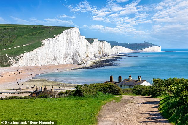 Lizzie says: 'Our final day's walk from the elegant 19th-century colonial-style Wingrove House in Alfriston takes us along the dramatic chalk cliffs of the Seven Sisters (above).'