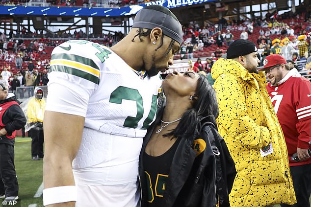 Simone Biles kisses her husband Jonathan Owens when he was a member of the Packers