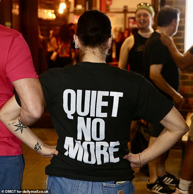 After the first night's show, he put on a black T-shirt with the word 