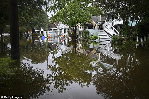 Storm Debby has continued to pick up speed north and northeast from the Carolinas, though it continues to bring heavy rain, flash flooding, and the threat of tornadoes (pictured: Charleston, South Carolina, on Tuesday)