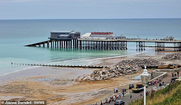 Pictured is a general view of the coastline at Cromer, Norfolk. Visitors and locals alike were impressed by the blue waters.