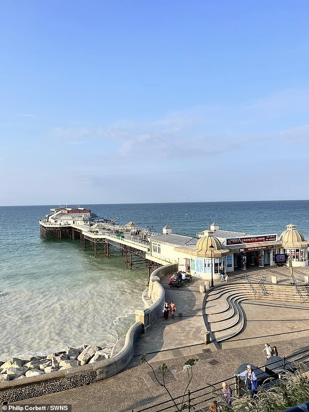 Workers digging into the seabed beneath the beach have exposed a layer of chalk sediment that is mixing with the water above and changing its hue.