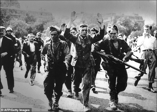 German soldiers surrender to French troops in August 1944 before the liberation of Paris.