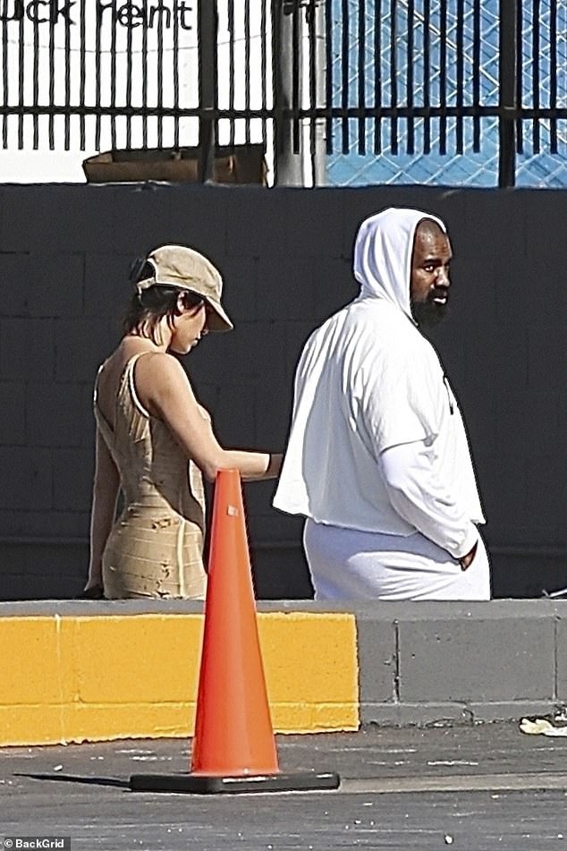 Meanwhile, rapper Gold Digger, 47, was fully covered as usual, this time in a white hoodie and white pants.