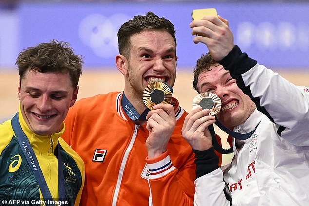 Lavreysen (centre) and bronze medallist Jack Carlin (right) of Britain put a smile on Richardson's face with a display of enthusiasm on the podium.