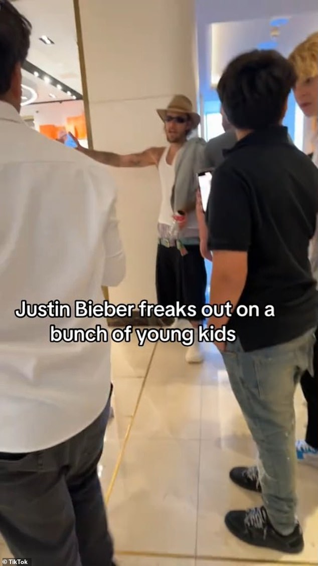 The 30-year-old pop superstar, looking almost unrecognizable in a disheveled outfit, confronts the group of young people in the lobby of the Waldorf Astoria in West Hollywood during the 12-second TikTok.