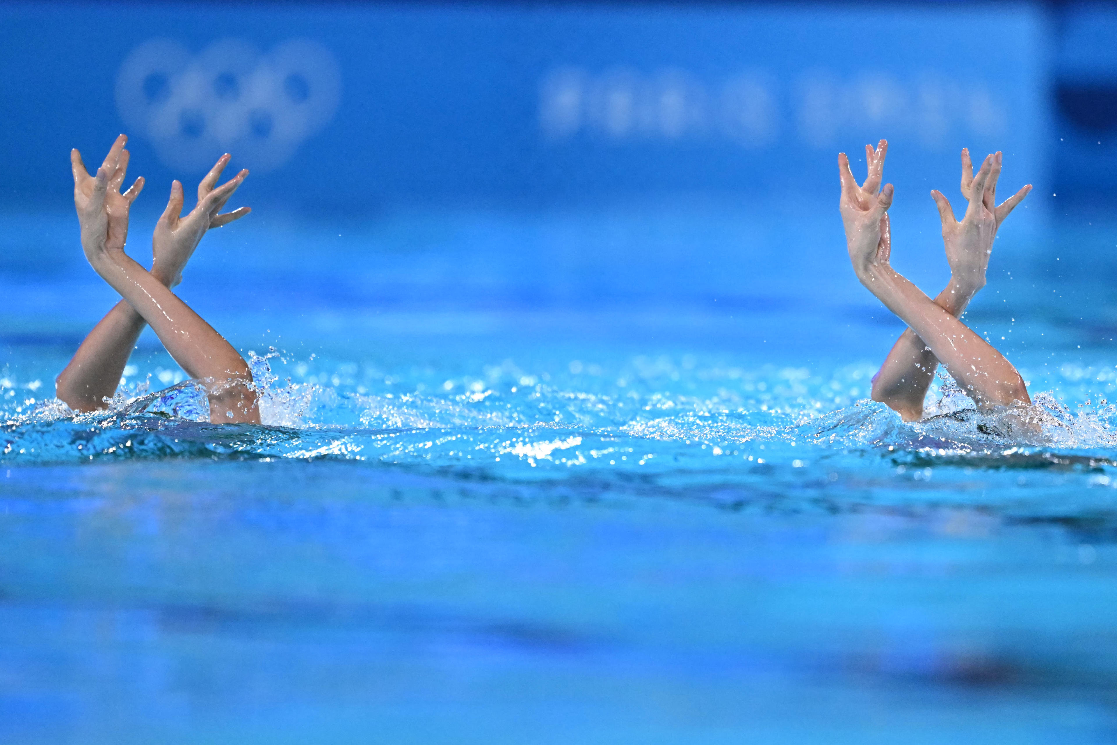 China's Wang Liuyi and Wang Qianyi compete in the duo technical routine of the artistic swimming event during the Paris 2024 Olympic Games at the Saint-Denis Aquatics Centre, north of Paris, on August 9, 2024. (Manan Vatsyayana/AFP/Getty Images) 