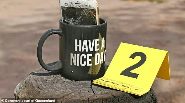 This 'Have a nice day'" The coffee cup was taped to a gate post near the entrance to the property.