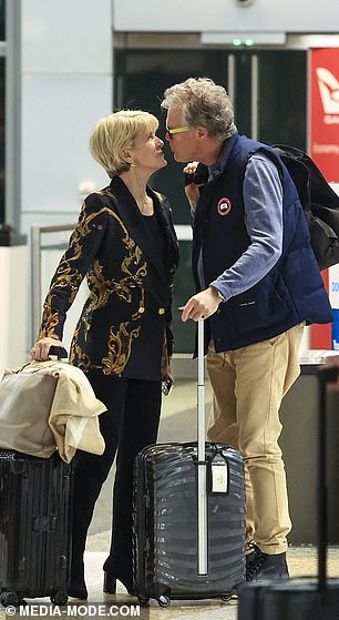 The 68-year-old former Australian politician was seen showing her affection for her new boyfriend as they arrived at Sydney Airport on Friday.