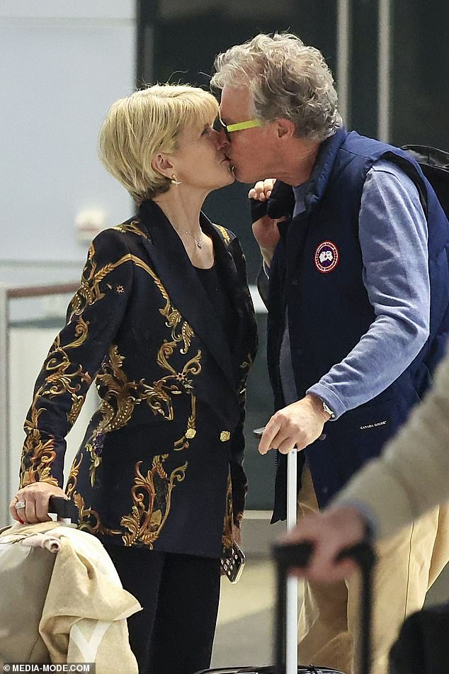 Ms Bishop, who was Australia's foreign minister from 2013 to 2018, shared a kiss with the Perth man as they stood near the Qantas counter with her luggage.