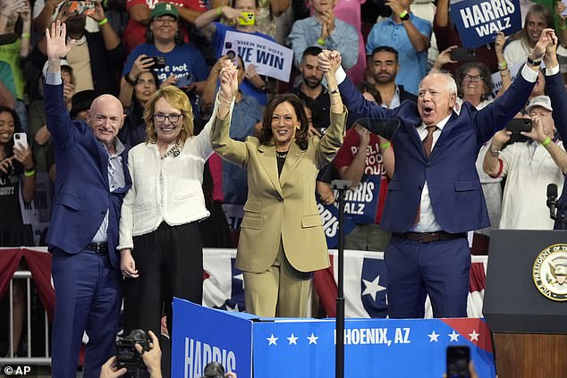 Harris was introduced by her running mate Tim Walz (right) and Arizona Senator Mark Kelly (left, with his ex-wife Congresswoman Gabby Giffords)