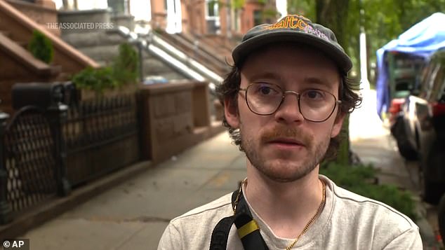 Two neighborhood residents, Emily Campbell and Max David (pictured), rescued some of the fish using nets and plastic bags.