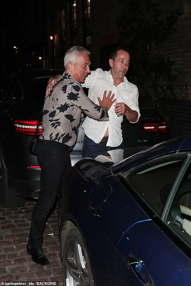 After dinner at the restaurant, Bruno playfully engaged in a brawl with an enthusiastic admirer as he headed to his car.