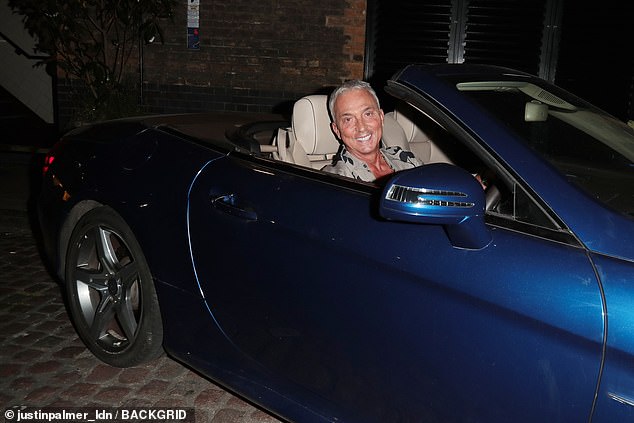 He then climbed into his sleek blue sports car before speeding off into the night.