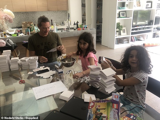 Her husband and two daughters help pack orders at home.