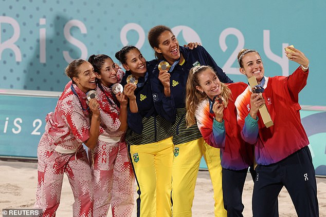 The good spirits between Canada and Brazil continued as they received their medals