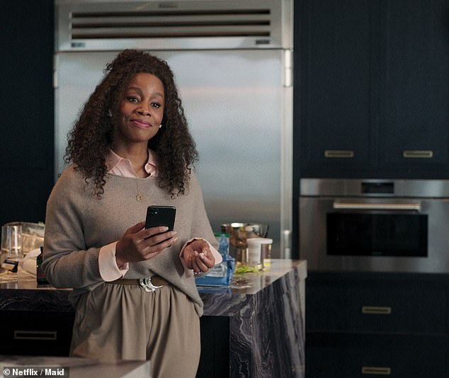 Anika Noni Rose plays Regina, one of Alex's clients who is initially bossy but develops a soft spot for the cleaner.