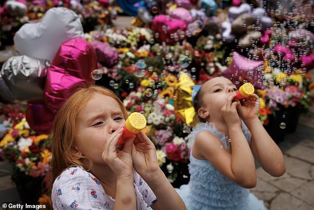 Three children were killed and ten people were injured during the attacks. A vigil was held for the victims on August 5 and the community gathered to support the grieving family.