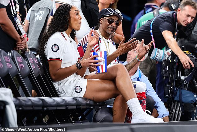 Snoop, whose real name is Calvin Cordozar Broadus Jr., appeared to be thoroughly enjoying the game, and was seen clapping and cheering on the players.