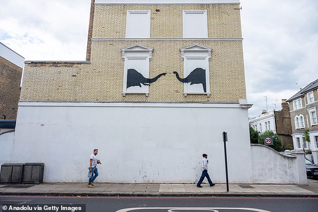 Today, fans of the artist gathered around a new work depicting a cat in Cricklewood.