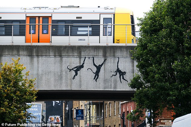 On Wednesday, the artist shared silhouettes of three monkeys on a bridge in east London.