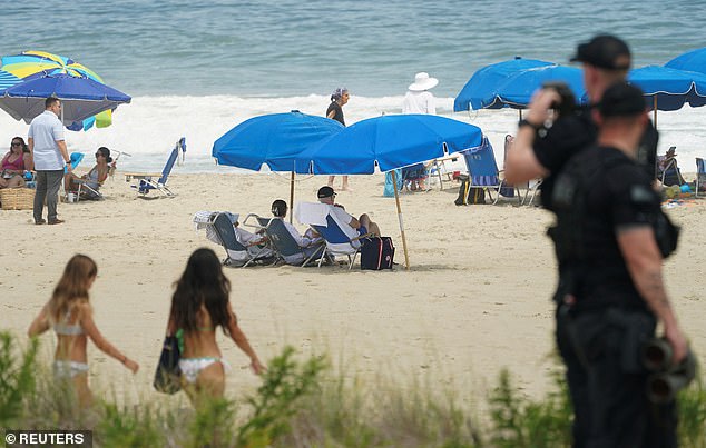 Beachgoers left the Bidens alone, though he received a round of applause and met with some children.