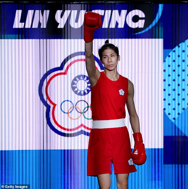 Lin, 28, is pictured waving to the crowd before entering the ring ahead of her gold medal fight.