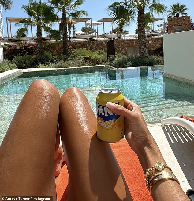 She also posted a photo of her tanned legs and showed off her collection of Cartier and Van Cleef bracelets while sipping on a lemon Fanta.