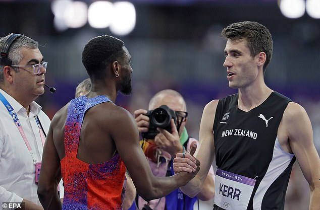 Second-ranked Shelby McEwen of the U.S. (left) shakes hands with first-ranked Hamish Kerr of New Zealand (right) after the men's high jump final