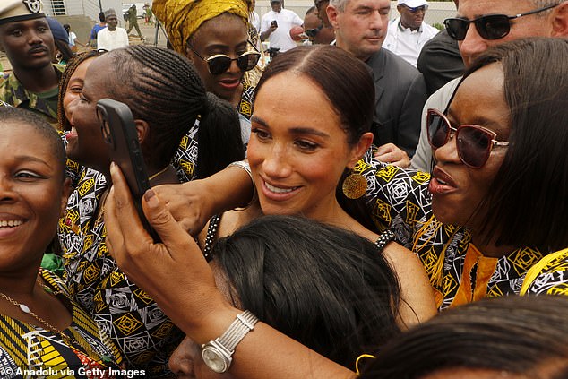 Meghan poses for a photograph at an exhibition volleyball match for Nigeria Unconquered, a community charity dedicated to helping wounded, injured or sick servicemen, as part of the Invictus Games anniversary celebrations in Abuja, Nigeria, on May 11.