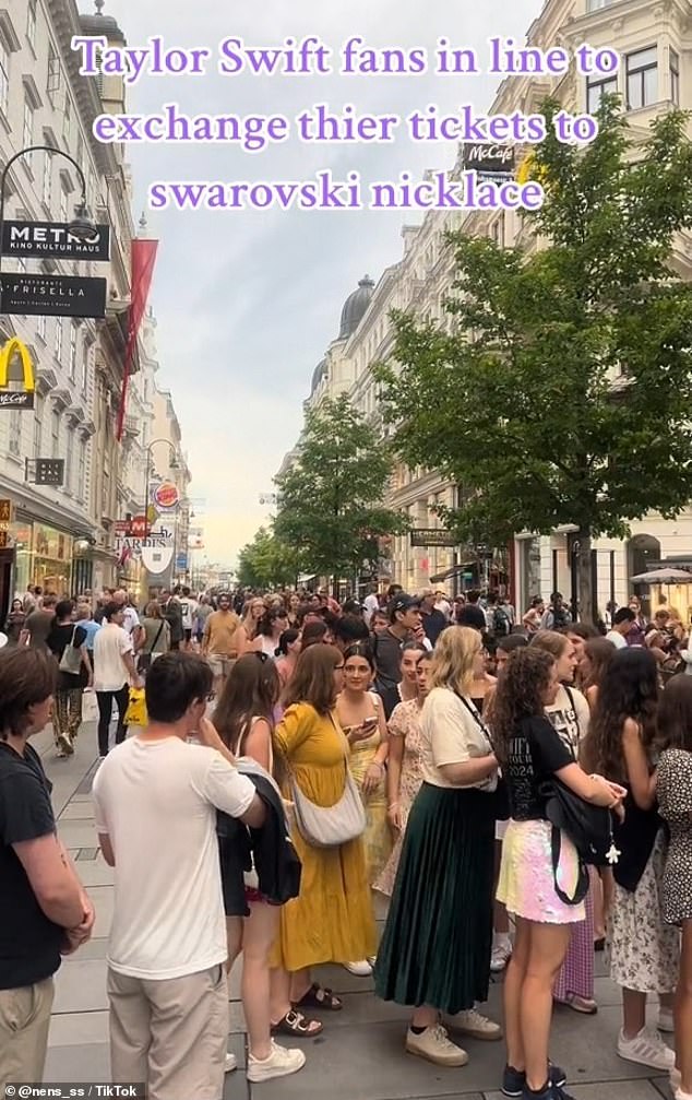 A video on TikTok showed hundreds of fans lining up at a store to claim their gift which included a blue stone or multi-coloured pendant on a grey leather cord.