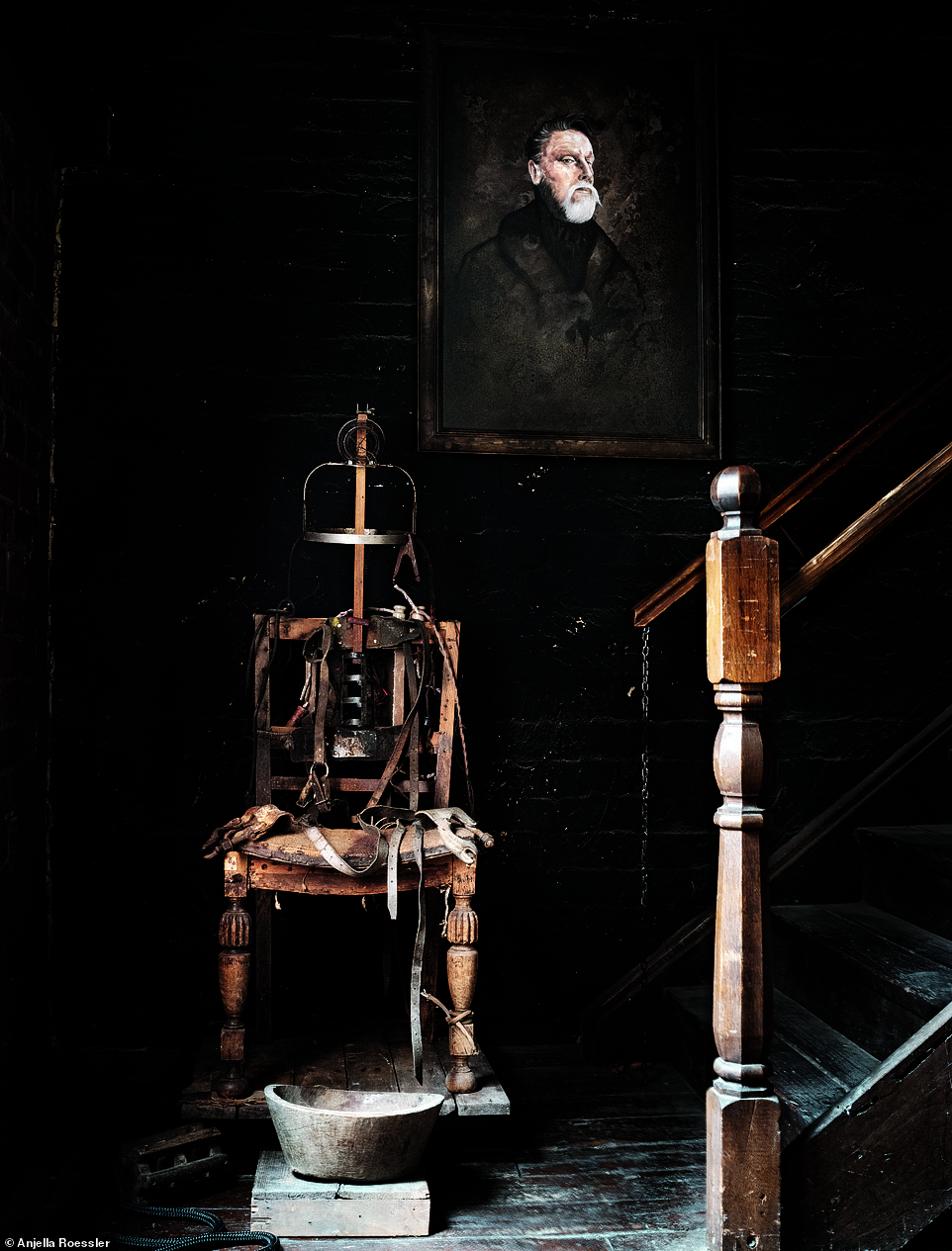 An antique electric chair is part of Andrew's collection. 