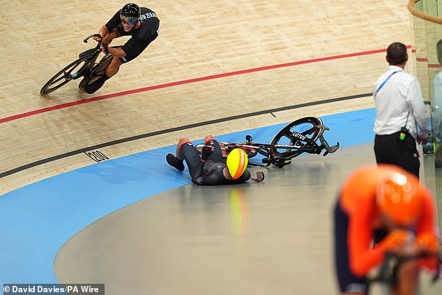 Britain's Ollie Woods crashes to the ground after colliding with Dutch rival