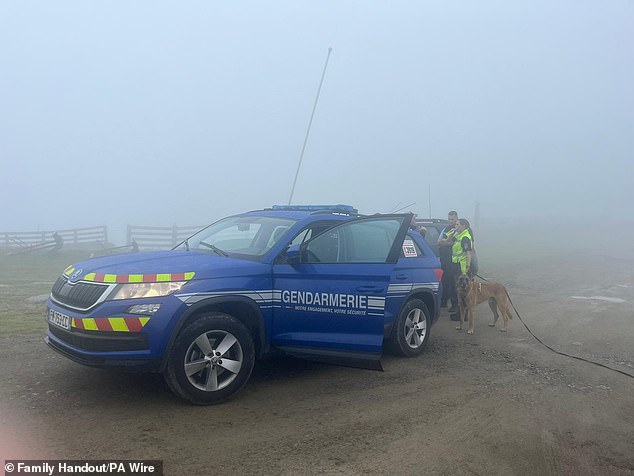 Search operations in the region have been hampered by poor visibility (pictured: gendarmes with a dog in the area)