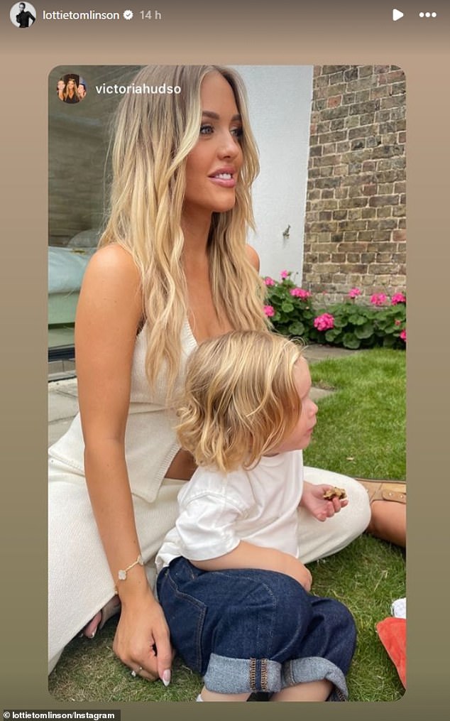 Lottie wore a cream waistcoat, fastened with a flower and a pair of matching cream floor-length trousers as she posed for photographs with her adorable little boy.