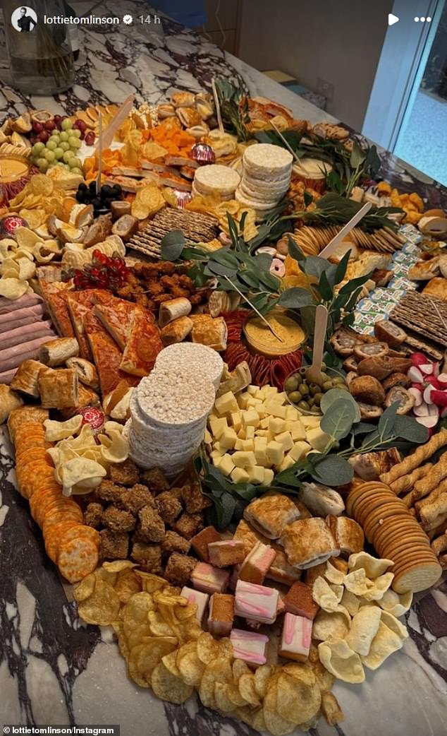 The model also took care of the adults and proudly showed off a giant cheese board filled with snacks and cookies, as well as cheese and fruit.