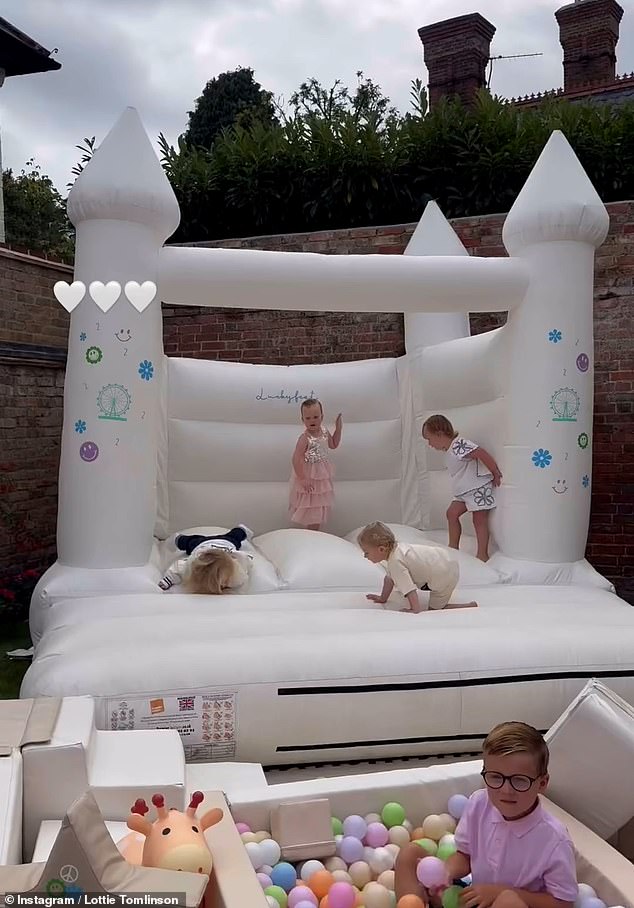 Lottie showed her fans a large white bouncy castle and a miniature ball pool with little children jumping around and having fun.