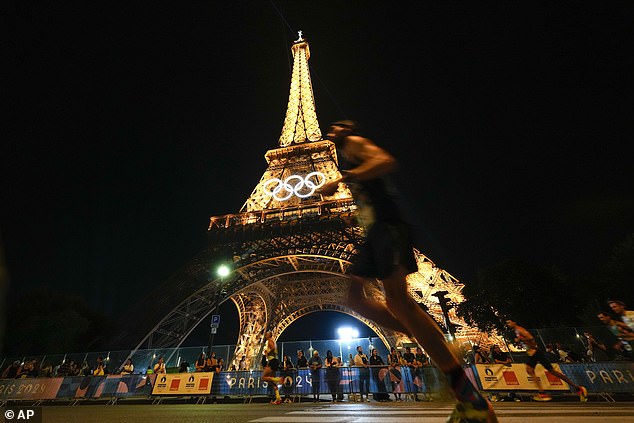 The Eiffel Tower has been evacuated after a man was seen climbing the iconic Paris landmark hours before the Olympic Games closing ceremony.