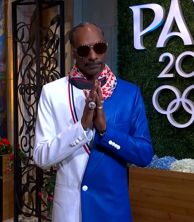 Rapper Snoop Dogg, who has been presenting for US broadcaster NBC at the Olympics, also appears in the star-studded video.