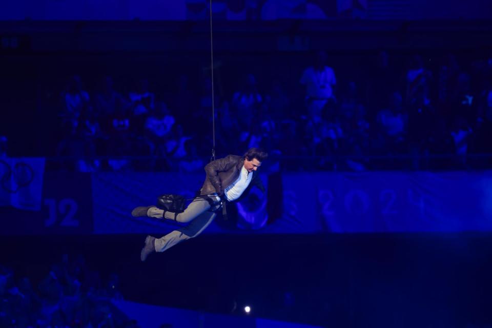 Tom Cruise jumps from the top of the State de France during the closing ceremony of the Paris 2024 Olympic Games on Sunday.