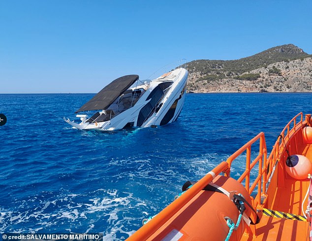 In images released by Mallorca's coastguard, the yacht, which is valued at an exorbitant £800,000, can be seen tipped on its stern with the bow of the boat rising above the water with pieces of debris floating in the water alongside the troubled vessel.