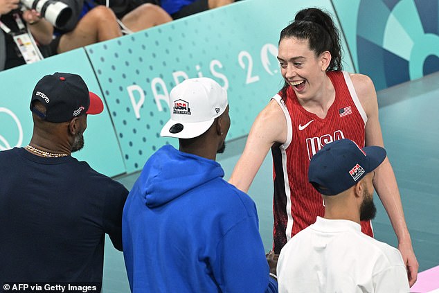 Breanna Stewart is congratulated by LeBron James, Bam Adebayo and Derrick White