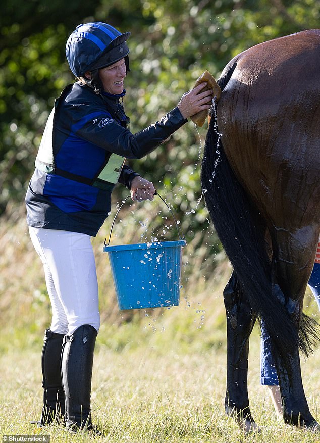 The 43-year-old royal was pictured giving her horse a wash after competing in horse trials this weekend.