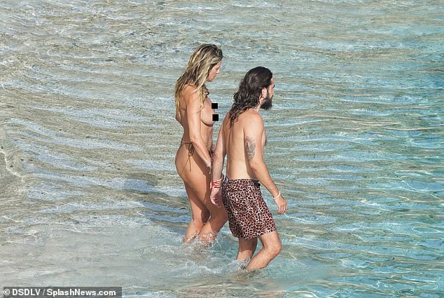 Tom was spotted hugging the TV presenter during their lively swim, sharing a tender kiss as they enjoyed the moment.