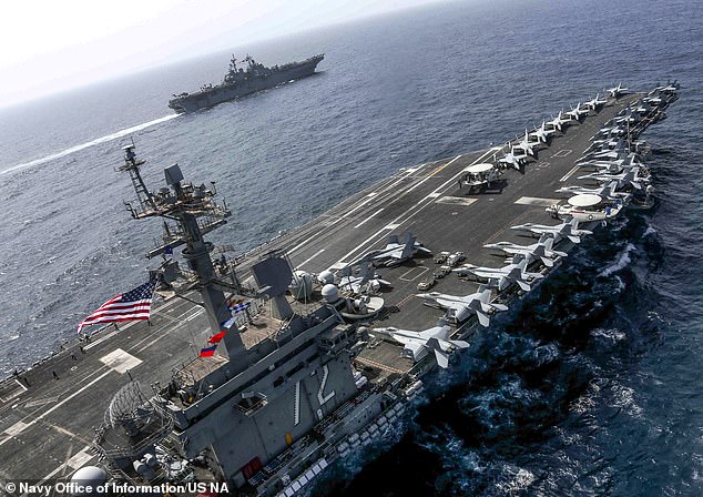 Austin ordered the USS Abraham Lincoln carrier strike group (pictured) to move quickly toward the area.