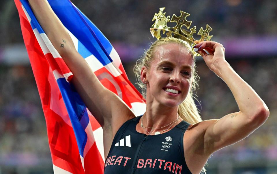 Keely Hodgkinson celebrates after winning the gold medal in the 800m