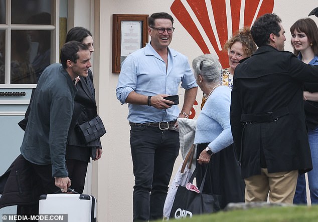 The group seemed in good spirits as they chatted outside the venue.