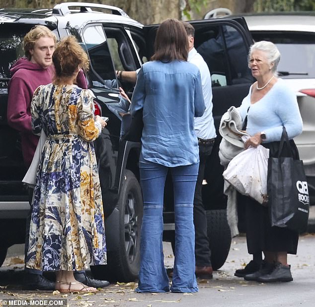 Karl's mother, Jenny (right), brought several bags to the scene.