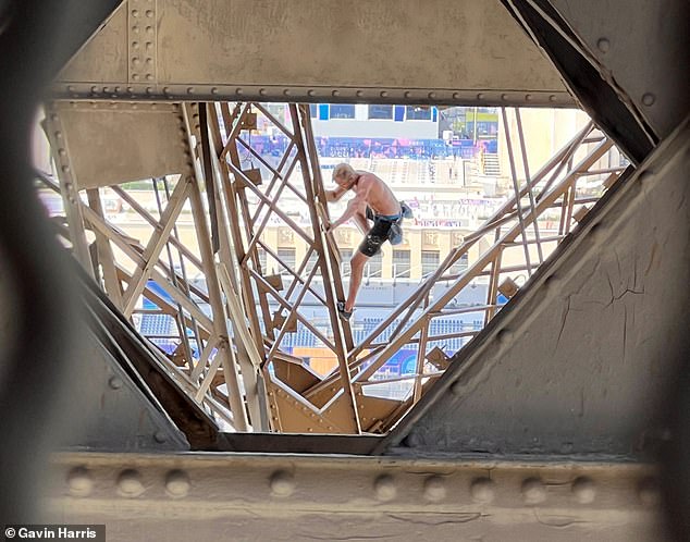 Davis is seen climbing the Eiffel Tower during the 2024 Summer Olympics, Sunday, Aug. 11, 2024.